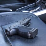 a must be concealed in a car in Florida a Gun on car seat uncovered is not legal