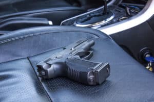 a must be concealed in a car in Florida a Gun on car seat uncovered is not legal